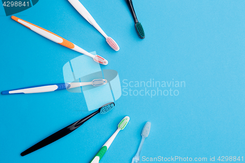 Image of Multicolored toothbrushes , place for inscription