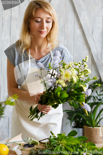 Image of Florist girl in flower shop