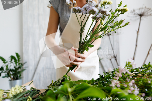 Image of Florist at work making bouquet