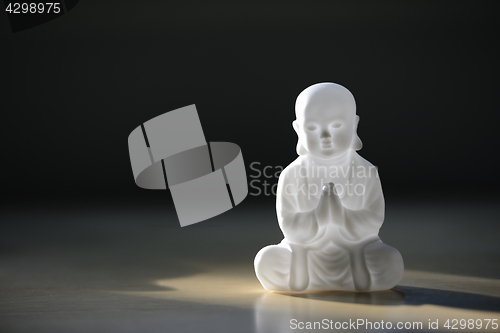 Image of plastic small buddha sculpture