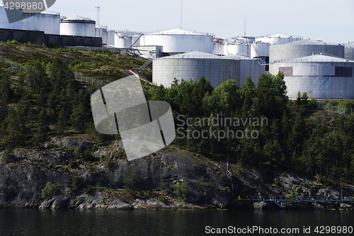 Image of tank farm on a rocky shore