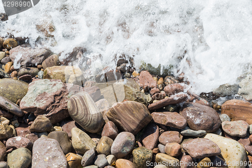 Image of Wet stones with foaming water