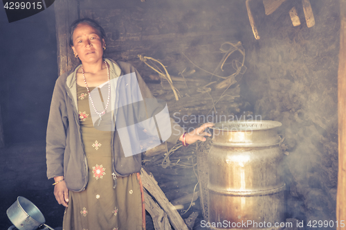 Image of Woman in smoke in Nepal