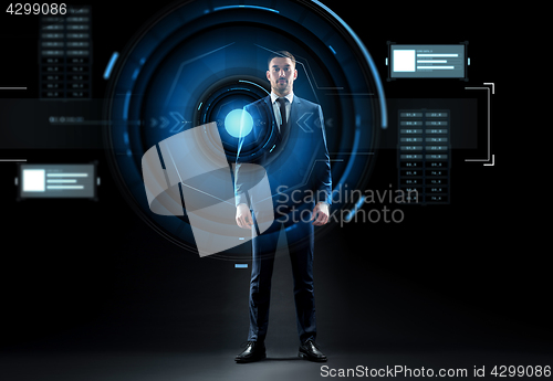 Image of businessman in suit with virtual projection