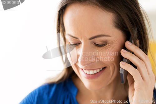 Image of close up of happy woman calling on smartphone