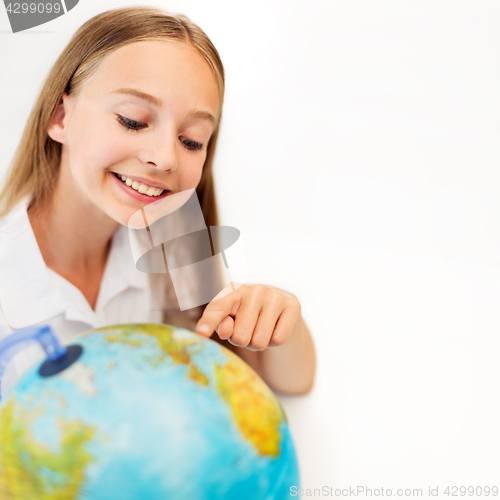 Image of smiling student girl with earth globe