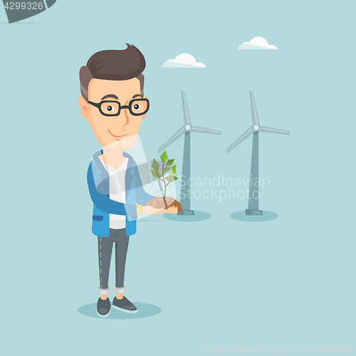 Image of Man holding small plant vector illustration.