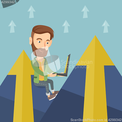 Image of Business man working on laptop in the mountains.