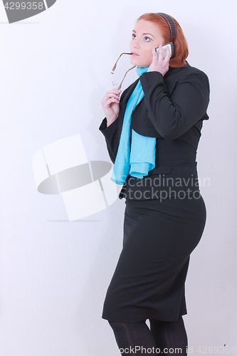 Image of Business woman phoning in