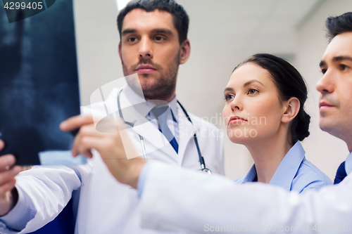 Image of group of medics with spine x-ray scan at hospital