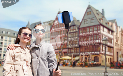 Image of girls with smartphone selfie stick in frankfurt