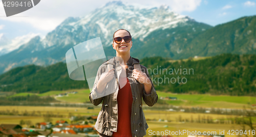 Image of happy woman with backpack traveling in highlands