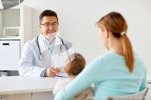 Image of happy woman with baby and doctor at clinic