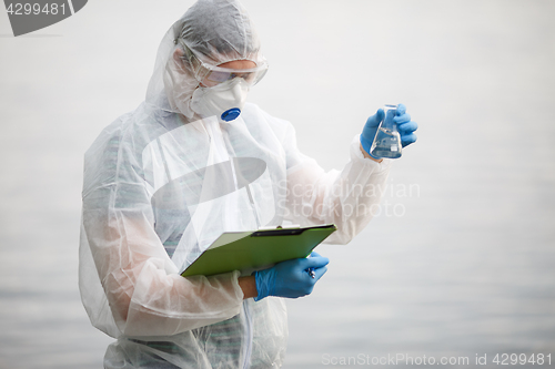 Image of Ecologist with bulb and folder