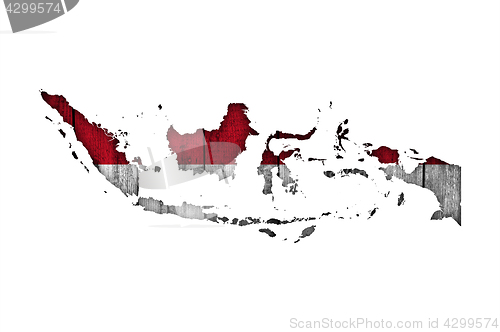 Image of Map and flag of Indonesia on weathered wood