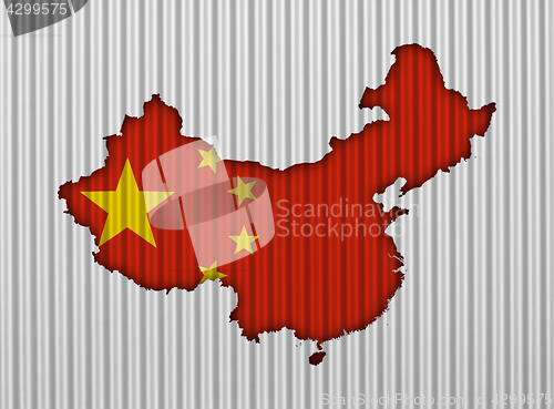 Image of Map and flag of China on corrugated iron