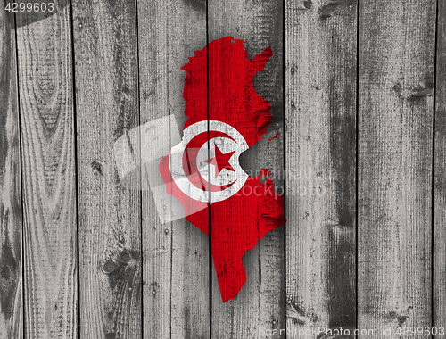 Image of Map and flag of Tunisia on weathered wood