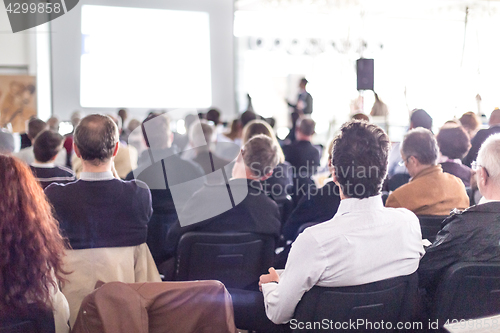 Image of Business speaker giving a talk at business conference event.