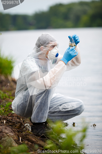 Image of Chemist with test-tube and water