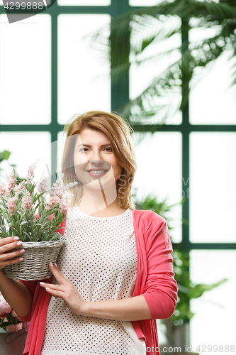 Image of Model with flower in pot