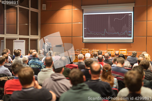 Image of Business speaker giving a talk at business conference event.