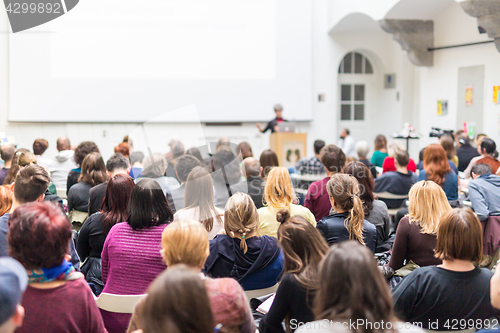 Image of Woman giving presentation on business conference.