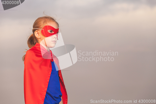 Image of Happy little child playing superhero.