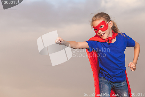 Image of Happy little child playing superhero.