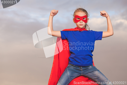 Image of Happy little child playing superhero.