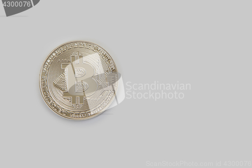 Image of Bitcoin coin with dollars
