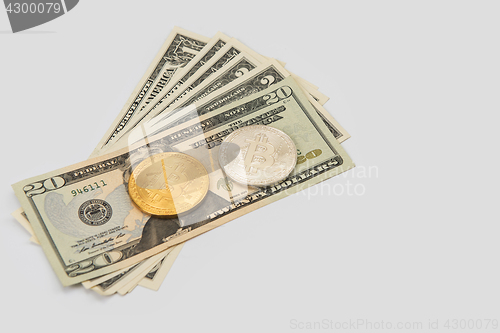 Image of Bitcoin coin with dollars