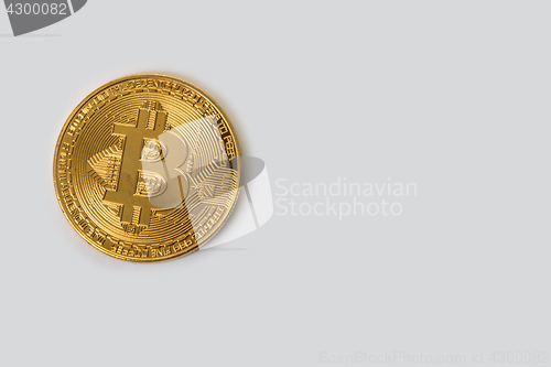 Image of Bitcoin coin with dollars