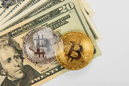 Image of Bitcoin coin with dollars