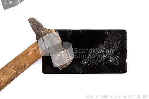 Image of An old hammer and smartphone