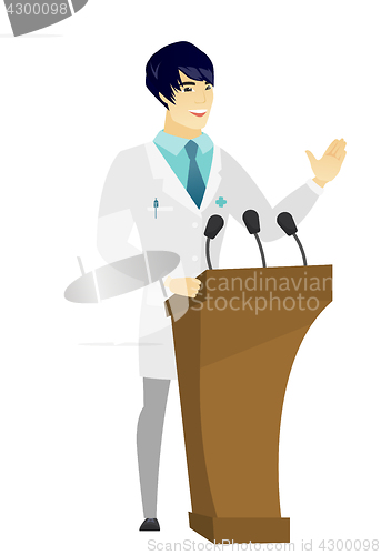 Image of Doctor giving a speech from tribune.