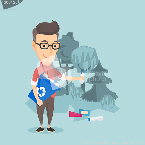 Image of Man collecting garbage in forest.