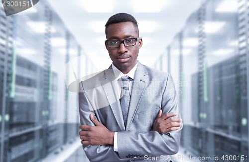 Image of Young  black man in server room