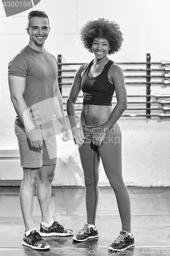 Image of black woman after a workout at the gym with a trainer