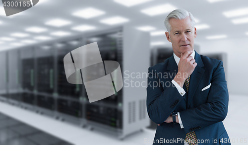 Image of Senior businessman in server room