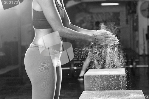 Image of black woman preparing for climbing workout