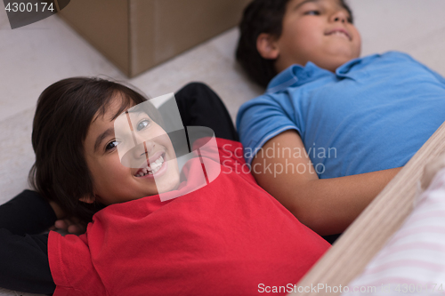 Image of young boys having fun on the floor