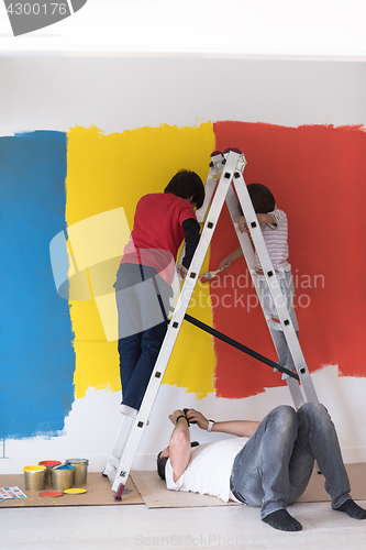 Image of boys painting wall