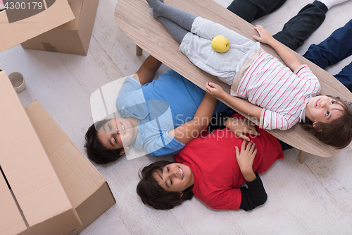 Image of boys with cardboard boxes around them top view