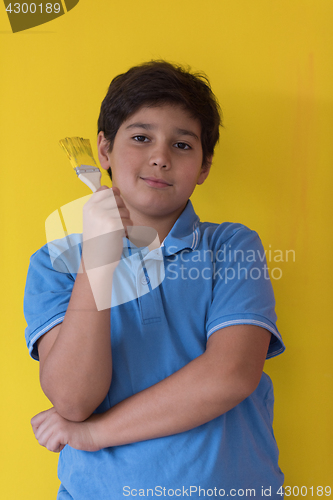 Image of Portrait of a happy young boy painter