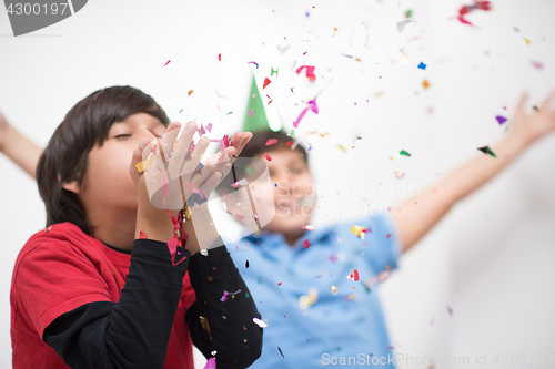 Image of kids  blowing confetti