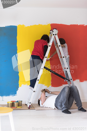 Image of boys painting wall