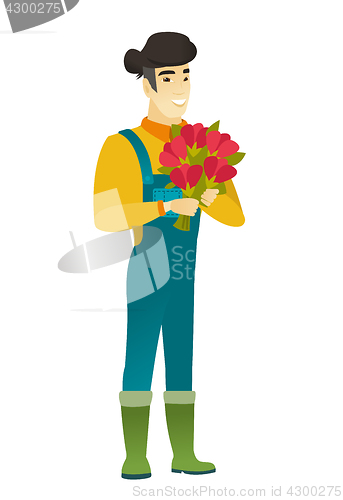 Image of Asian farmer holding a bouquet of flowers