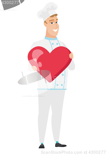 Image of Caucasian chef cook holding a big red heart.