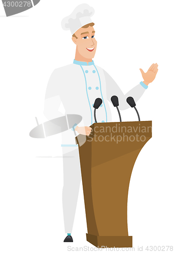 Image of Chef cook giving a speech from tribune.