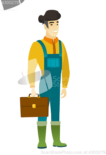 Image of Asian farmer holding briefcase.